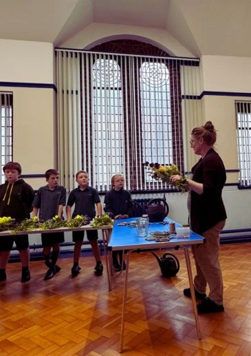 Cubs with Booker Flowers where Gemma taught them how to arrange flowers